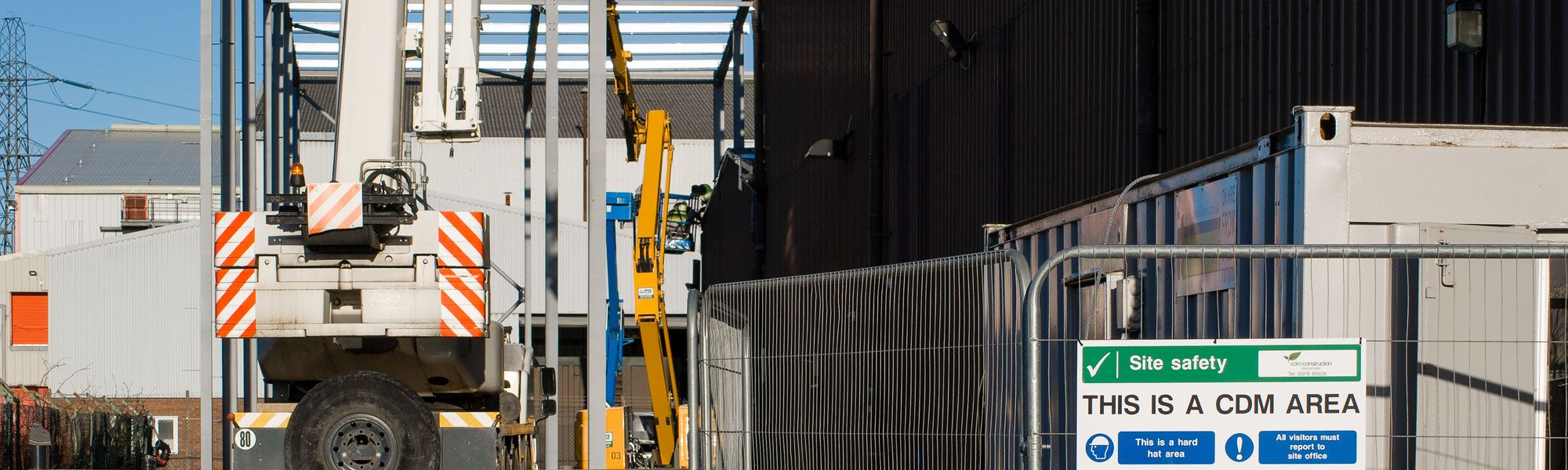 Crane on construction site in Chester with Site Safety sign